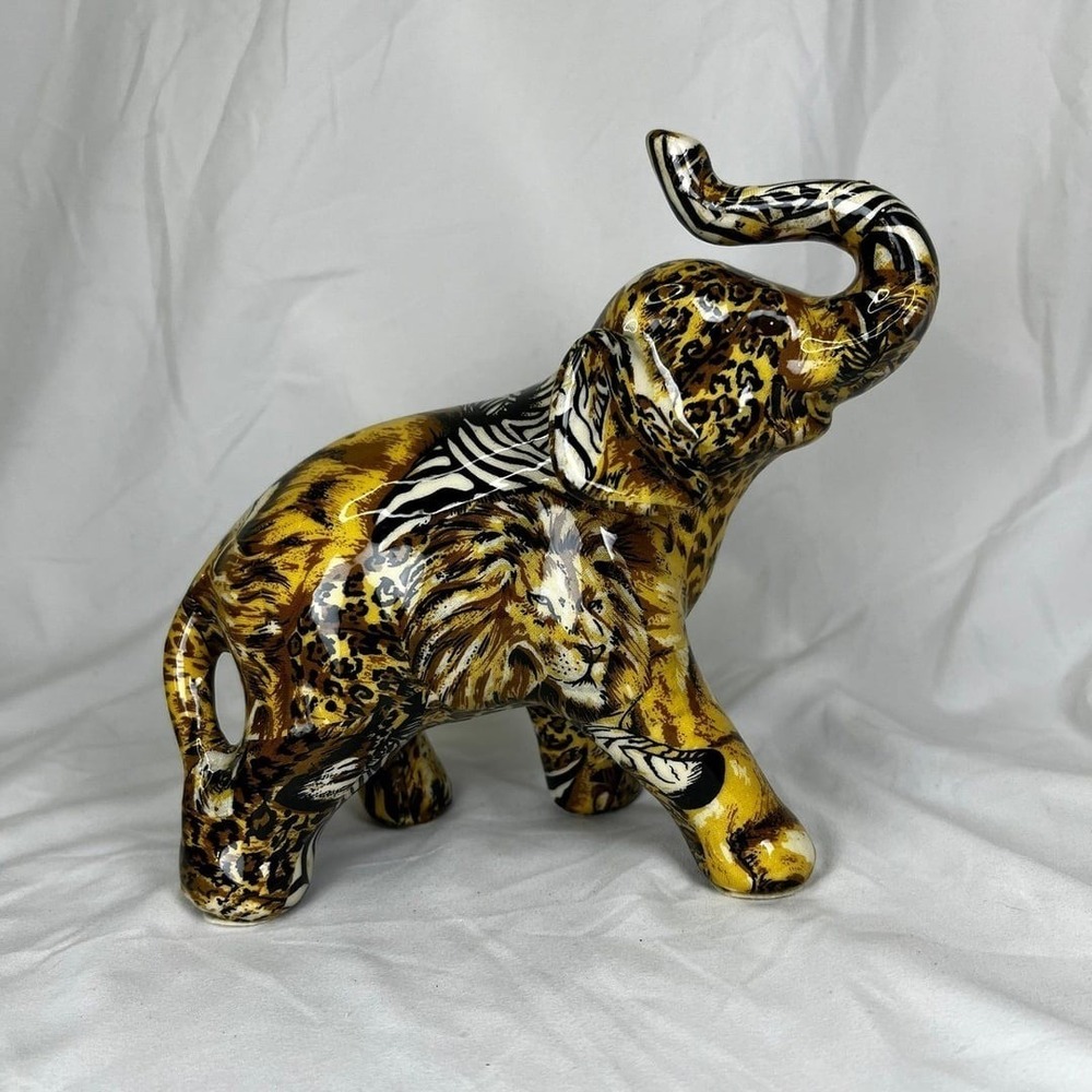 Elephant wrapped with cheetah, lion, zebra, etc.